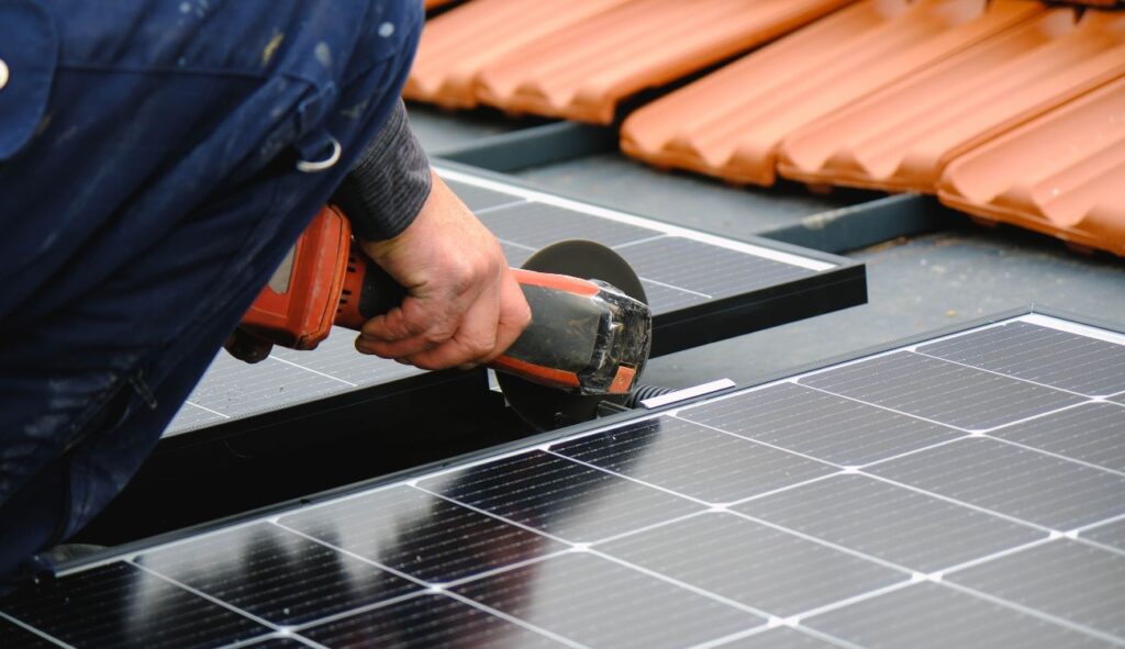 An engineer installing solar panels